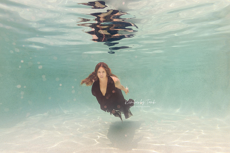 underwater fine art portraits in pool of woman in flowing black dress