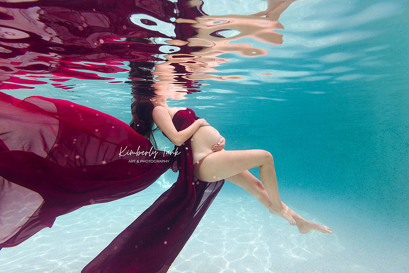 underwater maternity photo in pool