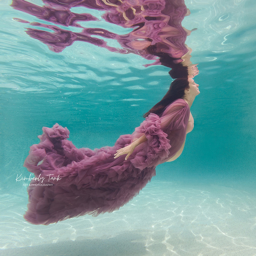 underwater maternity photo in pool