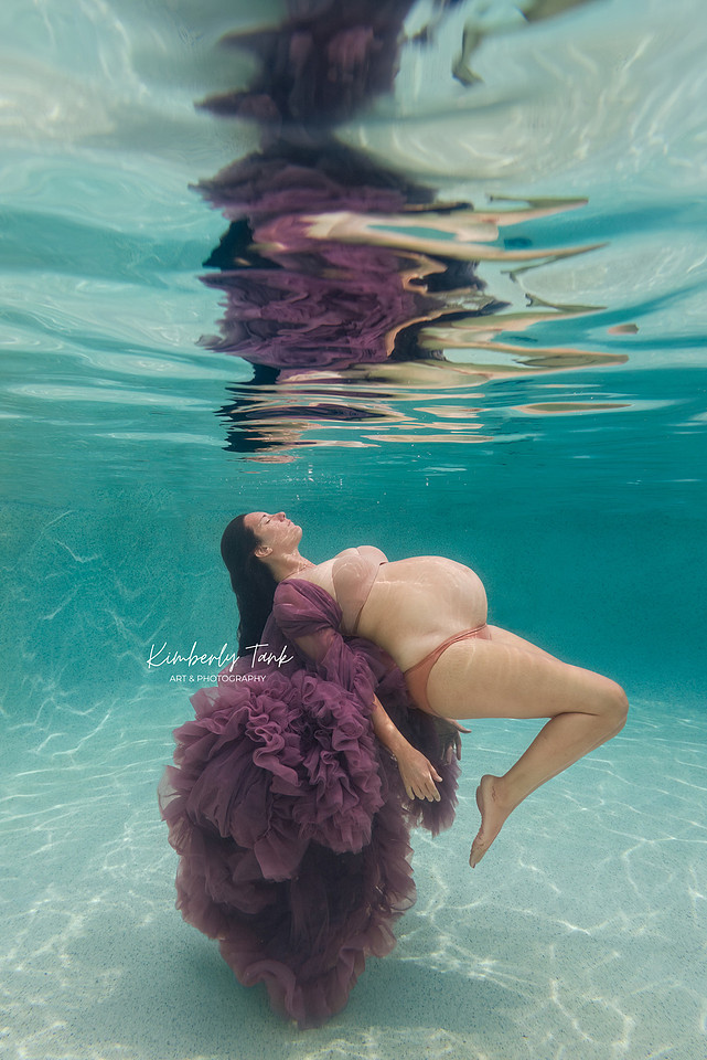 underwater maternity photo in pool