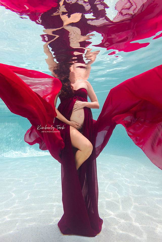 underwater maternity photo in pool