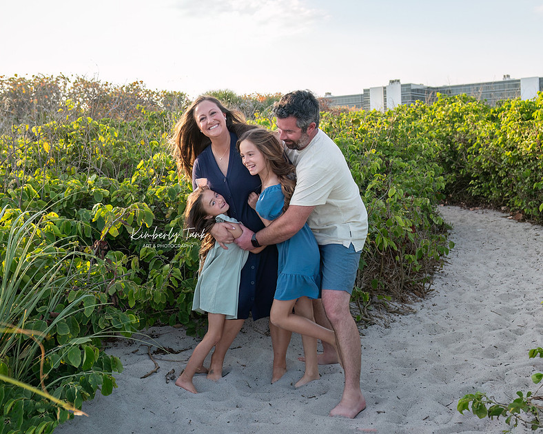 fun family photos on Cocoa Beach at sunset