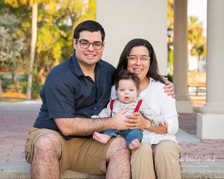 6 month old baby smiling big with mom at sunrise