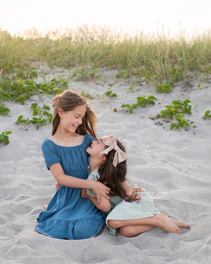 fun family photos on Cocoa Beach at sunset