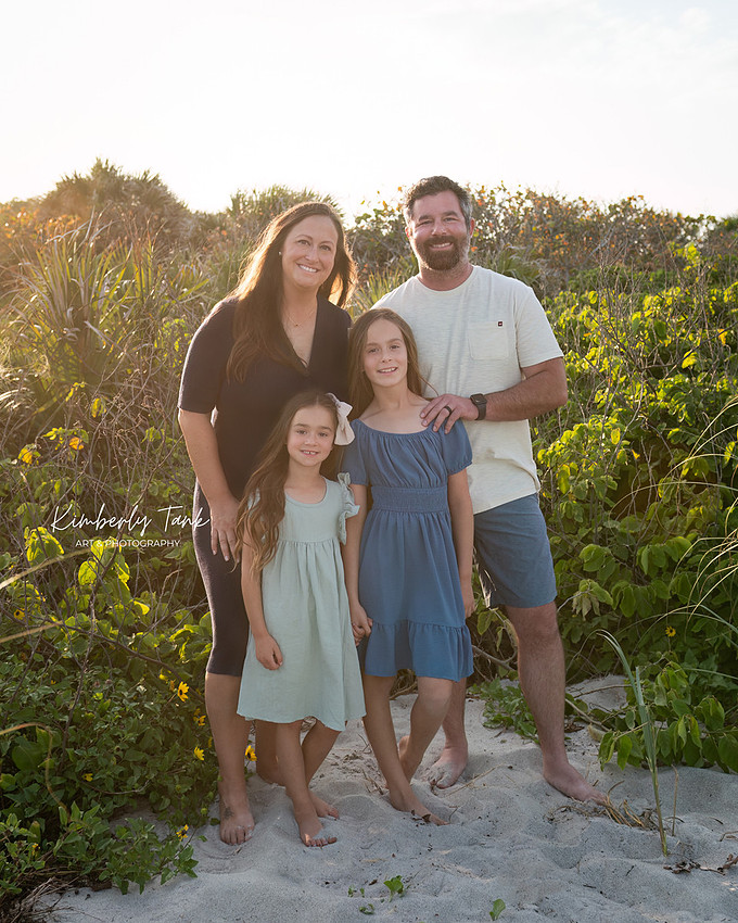fun family photos on Cocoa Beach at sunset