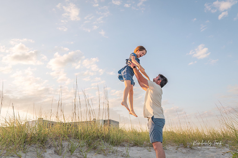 fun family photos on Cocoa Beach at sunset