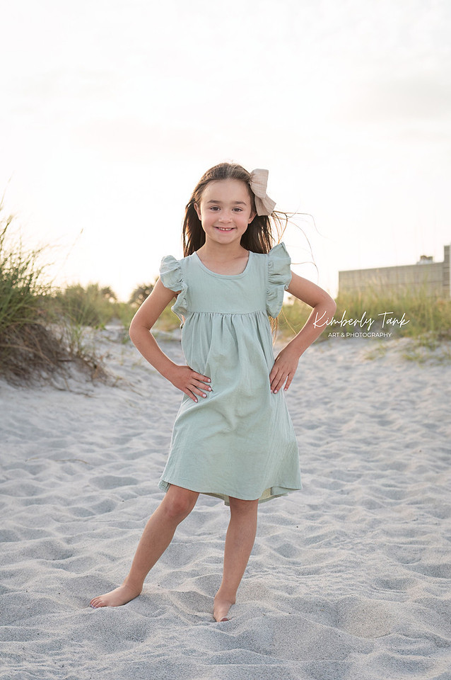 fun family photos on Cocoa Beach at sunset